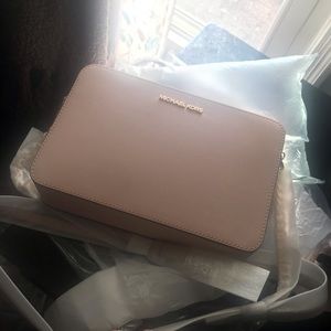 NWT blush pink MK crossbody includes dust bag.